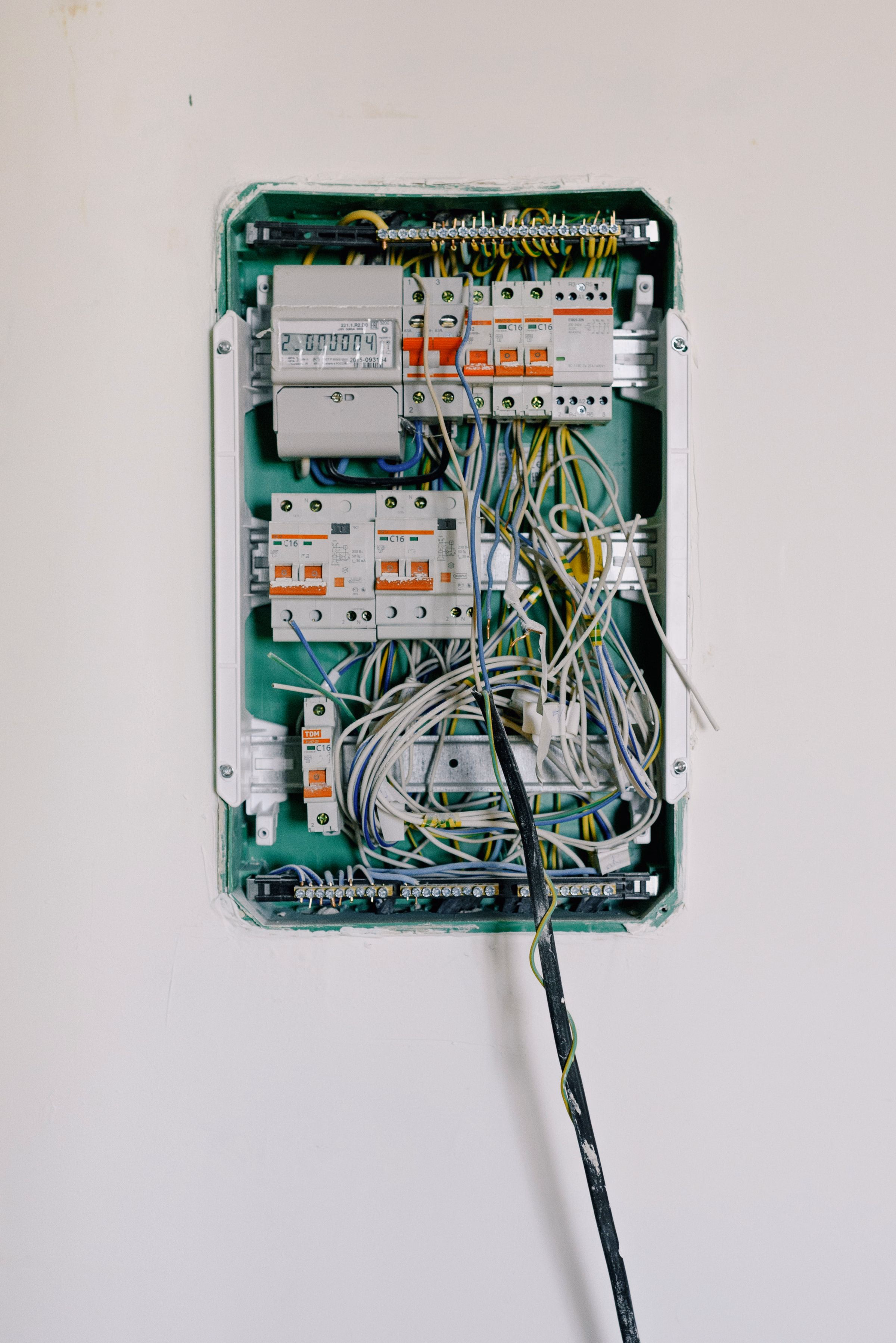 Switchboard panel with circuit breakers in neat rows.
